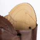 Close-up of the inner top of the boot showing soft leather lining and scalloped trim detail.