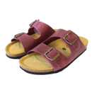 Pair of burgundy suede double-strap sandals with adjustable metal buckles and cork footbed