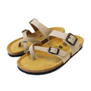 Pair of beige suede toe-post sandals with adjustable ankle strap and cork footbed