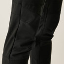 Angled rear view of black performance trousers highlighting tailored fit and subtle stretch material