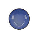 Top-down view of a blue speckled ceramic bowl with a glossy finish and dark rim.