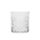 Close-up of an empty cut-glass whisky tumbler with a faceted pattern.