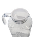 Overhead angled view of a glass jug featuring a white lid and curved handle.