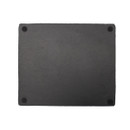 Underside of a rectangular slate serving board showing four small rubber feet for stability.