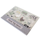 Angled view of the farm design worktop saver in its packaging, featuring animals, wellington boots and garden motifs.