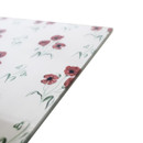 Close-up of the worktop saver corner showing red poppy pattern and smooth glossy surface.