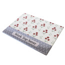Angled view of the poppy design worktop saver displaying full surface and packaging label.