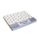 Angled view of the pack of six bee print placemats showing stacked edges and labelled packaging.
