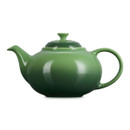 Rear angle of green ceramic teapot showing rounded body and handle detail