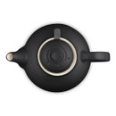 Top-down view of black teapot with lid in place, showing spout and handle alignment