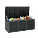 Open black outdoor storage chest filled with cushions and garden items, isolated on a white background