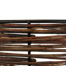 Close-up detail of woven willow branches attached to black steel support frame