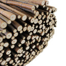 Detailed view of bundled willow fence screening showing cut wooden pole ends and natural timber texture