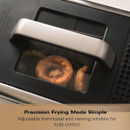 Close-up of food frying through the Hamilton Beach deep fryer viewing window.
