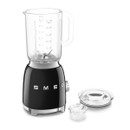 Angled view of the black SMEG jug blender with the lid and measuring cap removed, showcasing the blending jug, stainless steel blade assembly and included removable components.