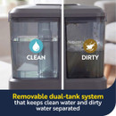 Close-up of the removable dual-tank system showing separate clean and dirty water reservoirs for hygienic cleaning.