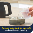 Close-up of the steam cleaner’s removable external water tank being refilled for continuous cleaning performance.