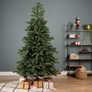 Full artificial Christmas tree with dense mixed-tip foliage and realistic green branches, styled in a modern living room with wrapped presents for a festive seasonal display.