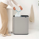 Brabantia Bo Touch Bin 60L in Mineral Concrete Grey with lid open, showing dual-compartment waste separation and removable inner buckets.