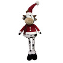 Festive standing cow Christmas decoration with black and white spotted design, wearing a red Santa-style coat, striped scarf, long Santa hat and plush winter boots.
