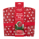 Red Christmas wreath storage bag supplied flat in retail packaging, featuring a white star and “Ho Ho Ho” festive print. Designed to store wreaths up to 61 x 61 x 20.5cm and protect seasonal decorations when not in use.