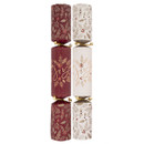 Set of Christmas crackers with coordinating burgundy and cream festive patterns, decorated with holly, berries, pinecones and gold ‘Joy’ lettering, finished with metallic gold ribbon ties.