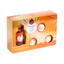 Elysium Spa Energise Gift Set in Bergamot & Mandarin fragrance, presented in an orange and gold gift box with decorative starburst detailing. The set includes a 50ml reed diffuser and three bath bombs, visible through cut-out display windows on the packaging.