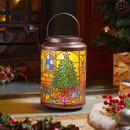 Illuminated Christmas lantern with stained glass-style Christmas tree and gift design, displayed beside a fireplace with festive decorations and wrapped presents.