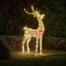 Illuminated outdoor reindeer Christmas decoration featuring warm white LED lights, a red bow accent, and a standing wireframe design for festive garden displays.