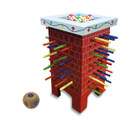 Christmas chimney drop game with a red brick-effect chimney tower, coloured wooden sticks, festive tokens and a wooden dice, isolated on a light grey background.