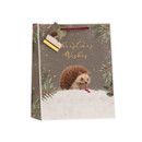 Medium Christmas gift bag featuring a hedgehog illustration in snow, festive foliage border, gold foil “Christmas Wishes” lettering, red rope handles and coordinating gift tag.