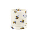 Alternative side angle showing the curved handle and detailed bee illustrations scattered across the ivory ceramic surface.