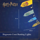 Harry Potter Hogwarts Crest Bunting Lights featuring illuminated pennants with official Gryffindor, Slytherin, Ravenclaw and Hufflepuff house crests on a 280 cm light string with 20 cm hanging flags.