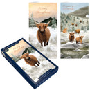Boxed set of 15 luxury Christmas cards featuring Highland cows in snowy winter landscapes with festive seasonal greetings.