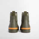 Rear view of olive green Chelsea wellington boots with pull tabs, elastic side panels, tartan lining at the collar, and contrasting mustard heel accents embossed with the Barbour logo.