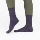 Warm winter sports socks with a comfortable mid-calf length, offering cushioning and a secure fit for riding and outdoor activities.