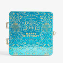 Cartwright & Butler Happy Birthday decorative blue keepsake gift tin with elegant gold birthday motifs, isolated on a white background.