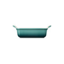 Side view of the rectangular stoneware baking dish highlighting its deep sides, integrated handles and Bleu Riviera exterior.