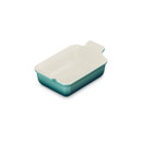 Three-quarter top view of the rectangular stoneware baking dish showcasing the spacious cream interior and Bleu Riviera finish.
