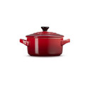Le Creuset Cerise stoneware mini round casserole dish with lid, shown from the side on a white background.