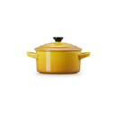 Side view of the Le Creuset Nectar stoneware mini round casserole dish with lid on a white background.