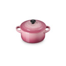 Le Creuset Rose Quartz stoneware mini round casserole dish with lid, shown at a three-quarter angle on a white background.