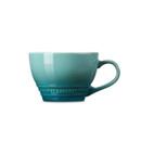 Side profile of the Le Creuset Grand Mug, featuring its wide bowl shape, signature rings and embossed Le Creuset branding.