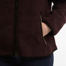 Close-up of the Barbour women's borg fleece jacket zipped hand pocket with soft teddy fleece fabric and contrast trim.