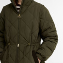 Close-up of the Barbour women's olive green quilted jacket showing the two-way zip fastening, adjustable drawstring waist and quilted finish.