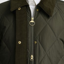 Close-up of the Barbour women's olive green quilted jacket featuring the corduroy collar, concealed two-way zip, press stud placket and diamond quilting.