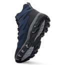 Angled underside view of a navy blue waterproof hiking boot highlighting the deep-lug outsole for enhanced grip on uneven terrain.