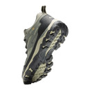 Angled underside view of a grey waterproof hiking shoe highlighting the deep-lug outsole for reliable grip on uneven terrain.
