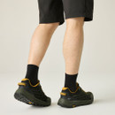 Rear three-quarter view of men's waterproof hiking shoes in olive green and black, highlighting heel support, rugged outsole and low-cut trail design.