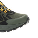 Close-up of the reinforced rubber toe cap on a men's olive green waterproof hiking shoe, highlighting durable protection for rocky trails.
